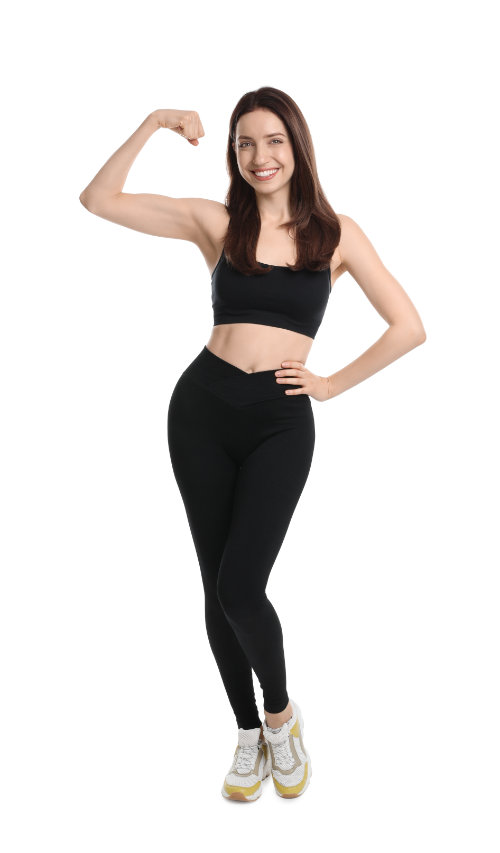 Happy young woman with slim body showing muscles on white backgr